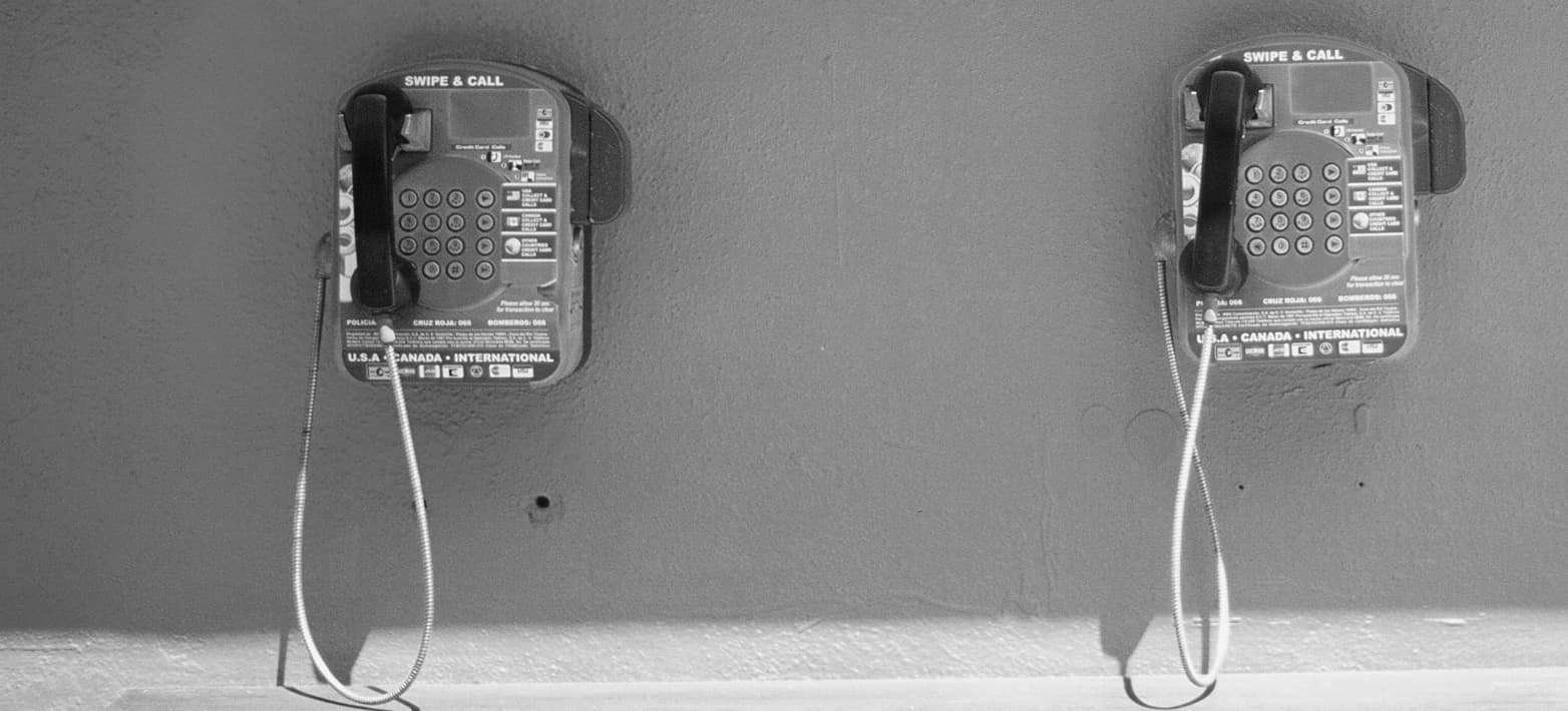 old phones hanging on the wall
